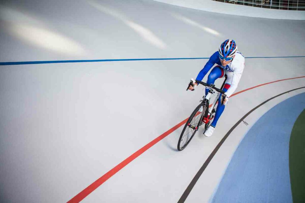 Small Changes, Big Impact: Person cycling indoor track
