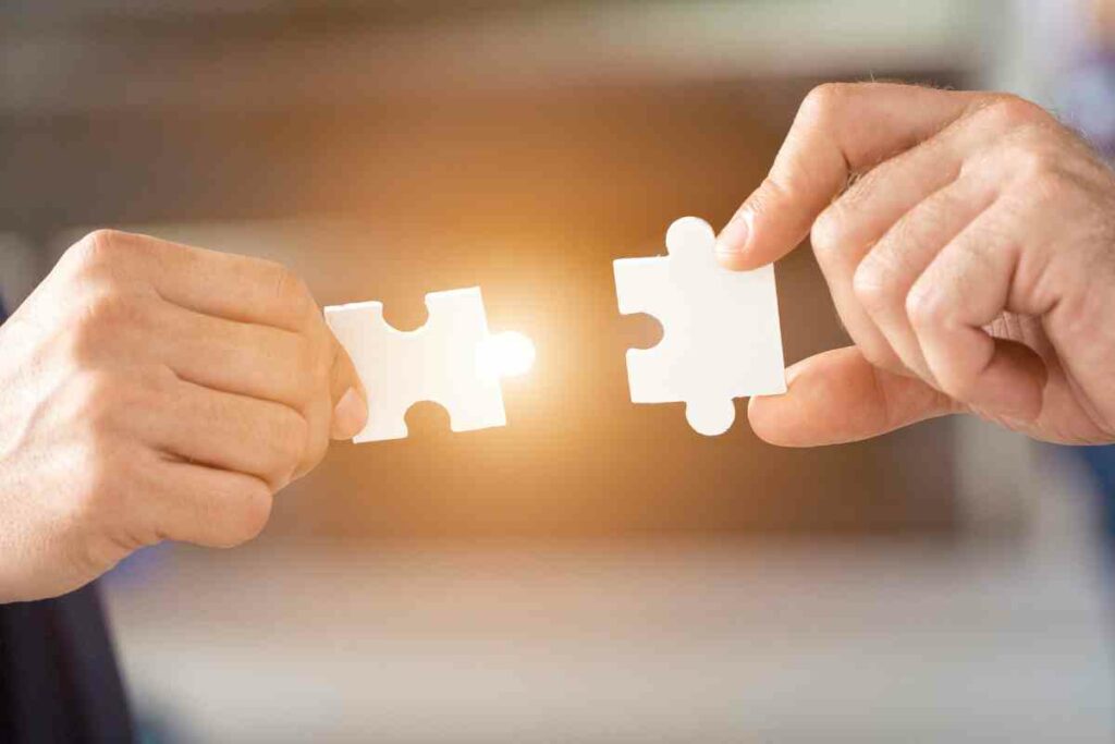 How to feel more connected - two different hands fit two puzzle pieces together
